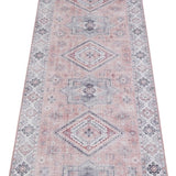 Elegant pink rug with intricate geometric patterns for stylish home decor