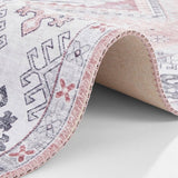 Elegant pink rug with intricate patterns and soft texture, perfect for adding colour to any room