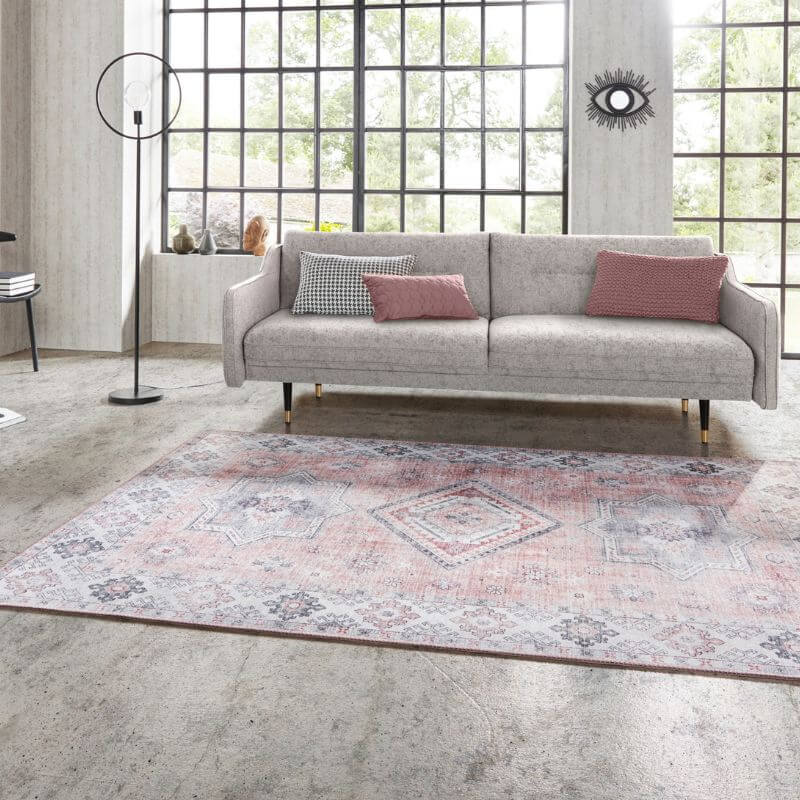 Elegant Pink Rug with intricate patterns, enhancing a modern living room setting