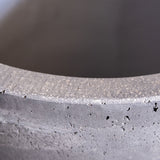 Close-up view of Jobu Home concrete planter showcasing textured finish and unique design