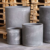 Set of four Jobu Home grey concrete planters for stylish indoor gardening