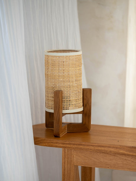 Elegant Rattan Lamp on a wooden table, featuring a minimalist design for a natural aesthetic