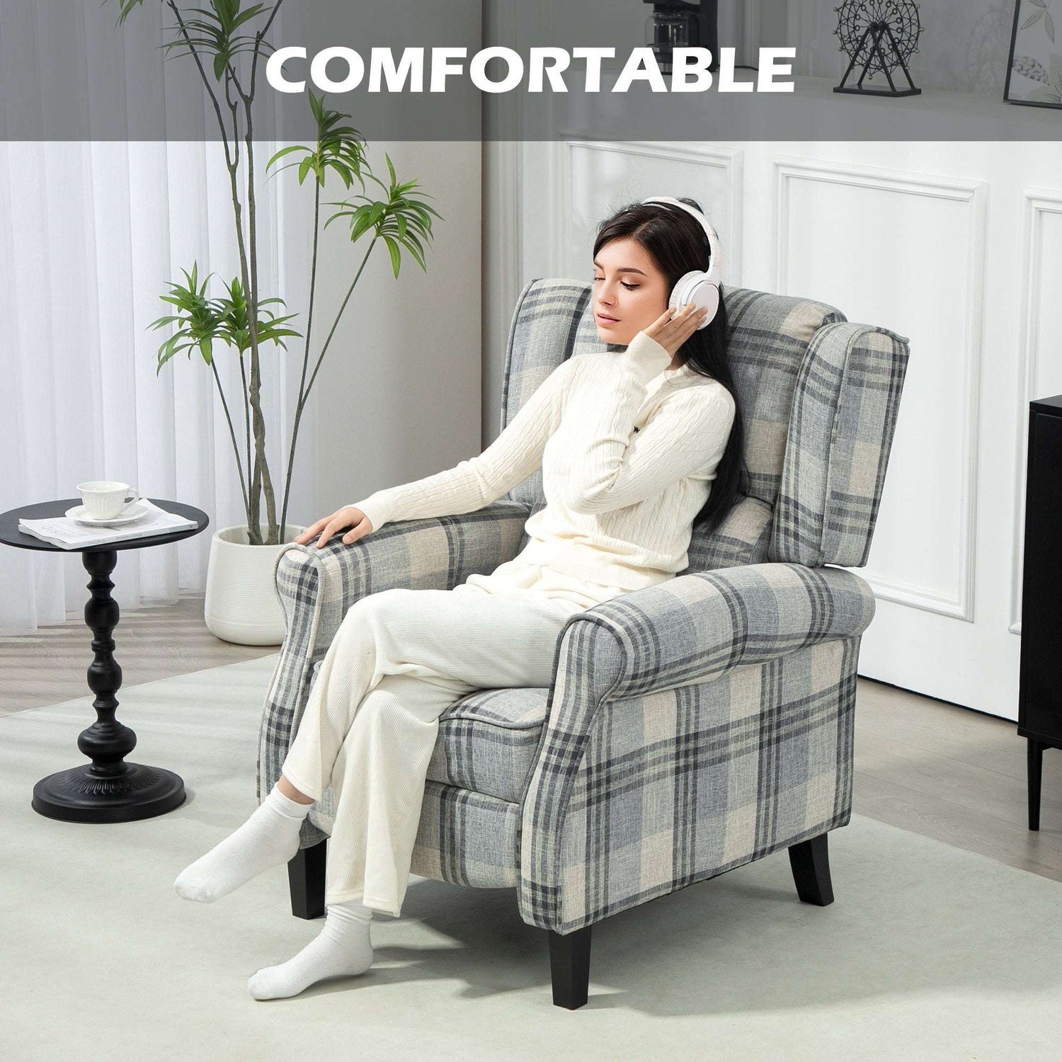 Comfortable reclining armchair in plaid fabric design for relaxation and leisure