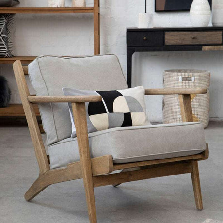 Orsina Rectangular Cushion in modern geometric design on a stylish wooden chair