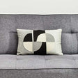 Orsina Rectangular Cushion with a stylish geometric design placed on a grey sofa