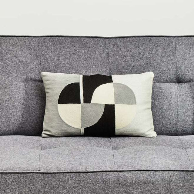 Orsina Rectangular Cushion with a stylish geometric design placed on a grey sofa