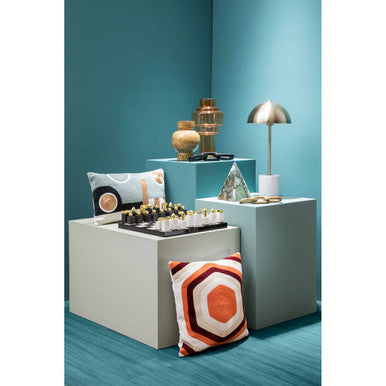 Colourful display of Orsina Rectangular Cushions with artistic patterns on a modern pedestal arrangement