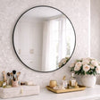 Jobu Home Circle Mirror with a sleek black frame, perfect for modern home interiors