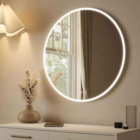 Round Mirror with LED Backlighting, ideal for brightening up any room elegantly