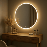 Elegant round mirror with LED lighting above a wooden vanity, perfect for modern interiors