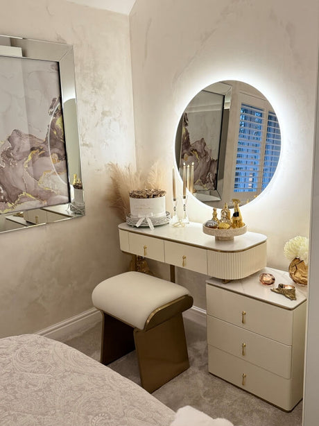 Stylish Round Mirror with LED Lighting above a chic vanity in a modern bedroom setting