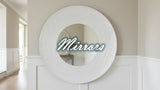 Stylish round mirror with textured frame, perfect for enhancing modern home decor