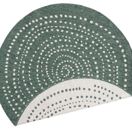 Stylish round rug with a patterned swirl design in green and white for modern home decor