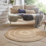 Beautiful round rug made of natural fibres, perfect for enhancing outdoor seating areas