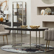 Orsina Round Rug placed under a modern round table in a stylish living room setting