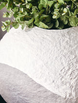 Stylish Round Vase by Orsina with a textured finish and greenery for modern home decor