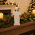 Rustic Angel Decoration on a Mantle with Candles and Festive Greenery for Christmas Room Decor