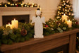 Rustic Angel Decoration on a Mantle with Candles and Festive Greenery for Christmas Room Decor