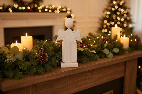Rustic Angel Decoration on a Mantle with Candles and Festive Greenery for Christmas Room Decor