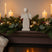 Rustic Angel Figurine on a Festive Mantel with Candles and Christmas Decorations