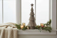 Rustic Bough Tree Christmas decoration on a window sill with candles and greenery