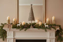 Rustic Decorative Tree on a festive mantel with candles and pine garland for Christmas room decorations