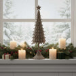 Rustic Decorative Tree displayed on a windowsill surrounded by candles and festive greenery