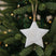 Rustic Hanging Star Christmas Bauble Decorated on a Festive Christmas Tree