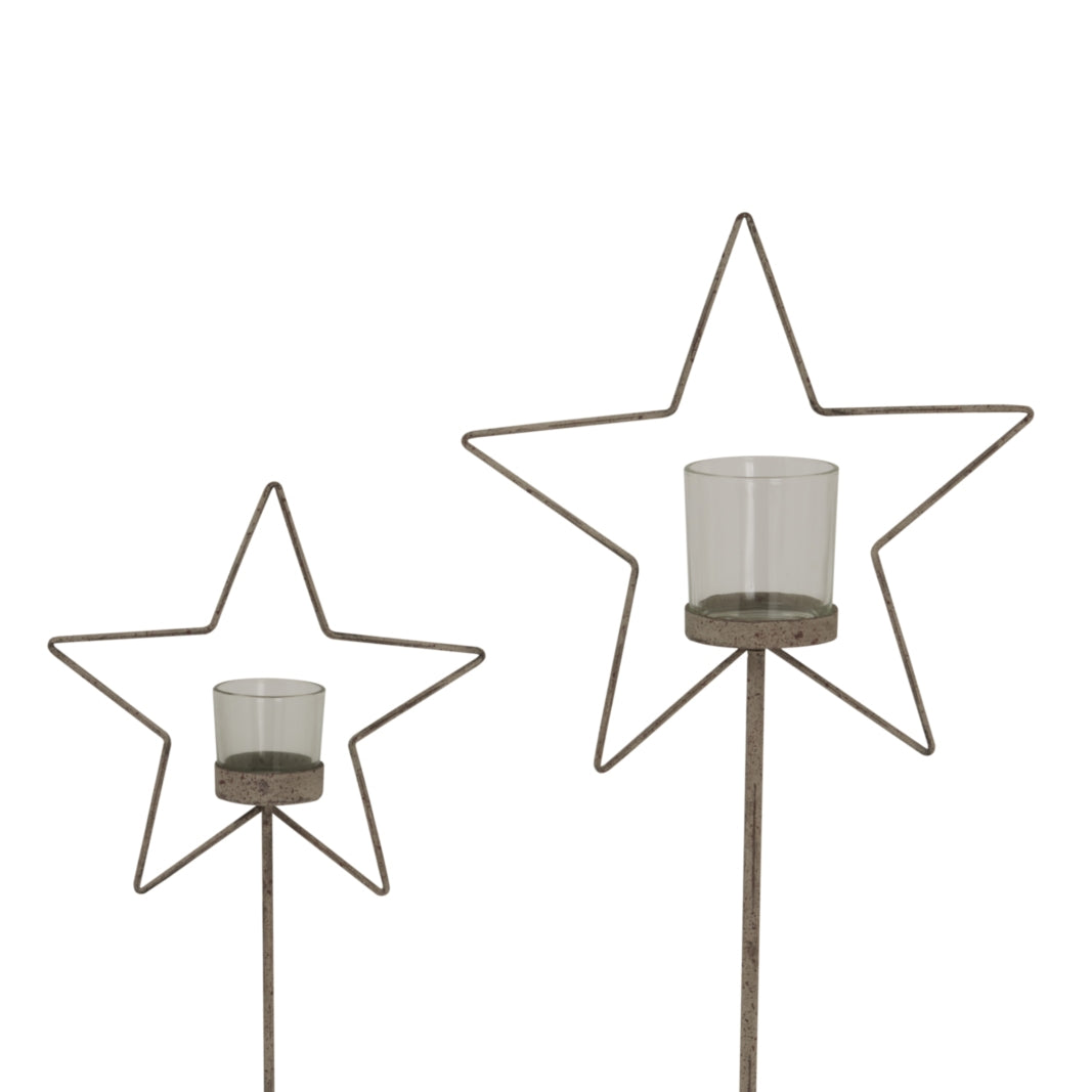 Set of Rustic Star candle holders in two sizes for festive Christmas decor and warm candlelight