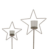Set of Rustic Star candle holders in two sizes for festive Christmas decor and warm candlelight