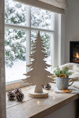 Rustic Tree decoration on a window sill with snowy backdrop and warm festive atmosphere