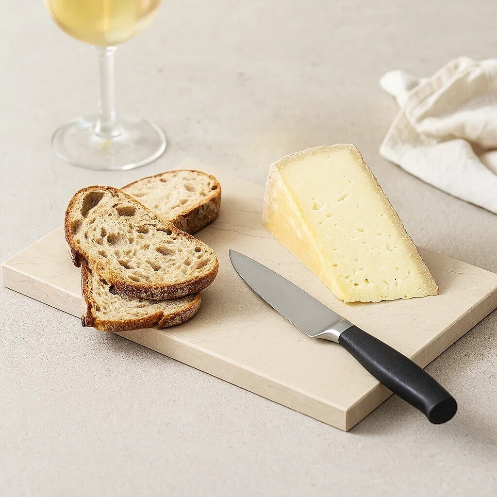Orsina Serving Board with slices of bread and a wedge of cheese, perfect for entertaining