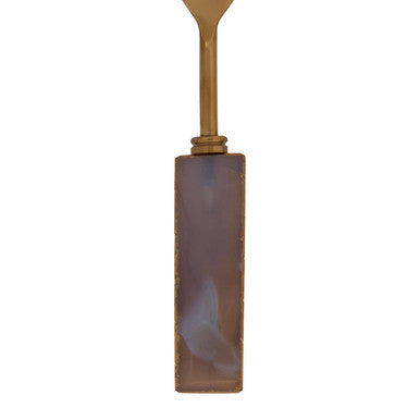 Orsina serving set featuring an elegant serving spoon with a polished handle and decorative stone design
