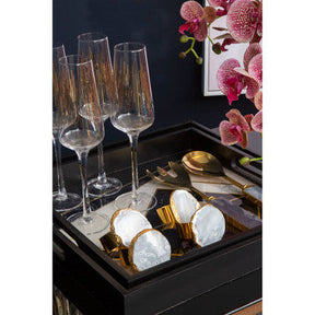 Orsina Serving Set featuring elegant gold utensils and stylish glassware on a decorative tray