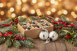 Set of Baubles in White and Silver, displayed with festive greenery and lights for Christmas decoration