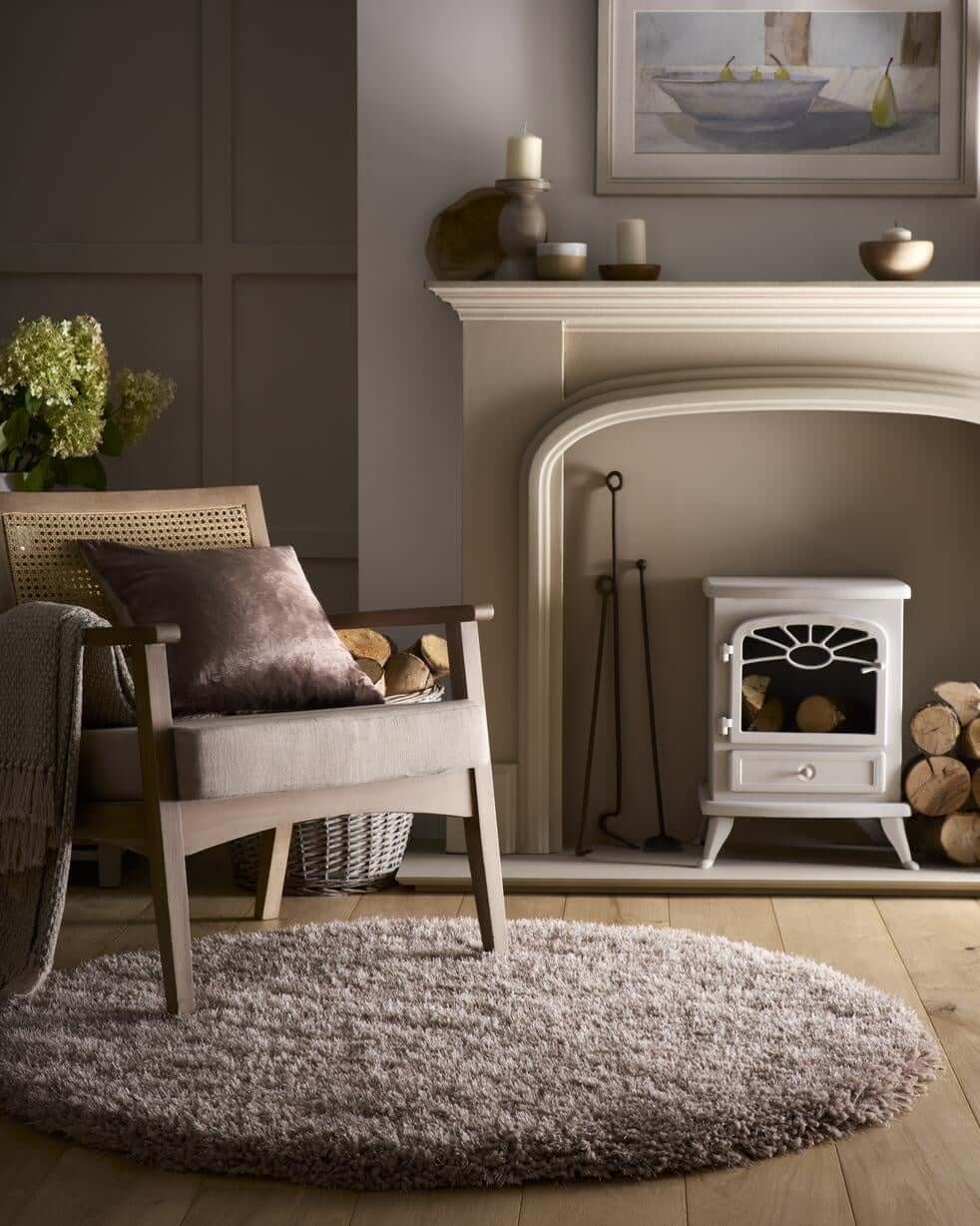 Soft Shaggy Rug in a cosy living room setting with a wooden chair and fireplace