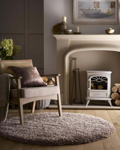 Soft Shaggy Rug in a cosy living room setting with a wooden chair and fireplace