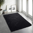 Plush black shaggy rug placed in a modern living space with natural light