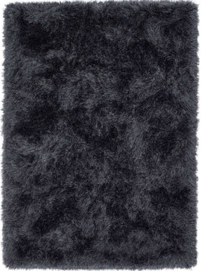 Soft black shaggy rug with a plush texture for a warm and cozy home decor