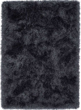 Soft black shaggy rug with a plush texture for a warm and cozy home decor