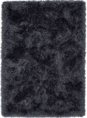 Soft black shaggy rug with a plush texture for a warm and cozy home decor