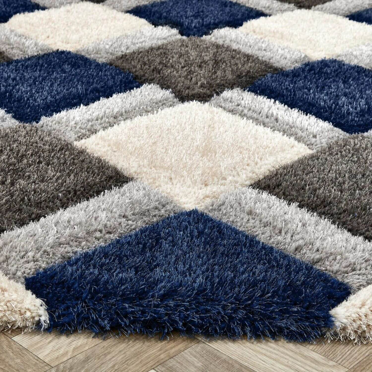 Geometric pattern shaggy rug in cream, grey and navy blue, adding comfort to your living space