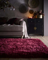 Luxurious deep burgundy shaggy rug enhancing a stylish living space with plush texture