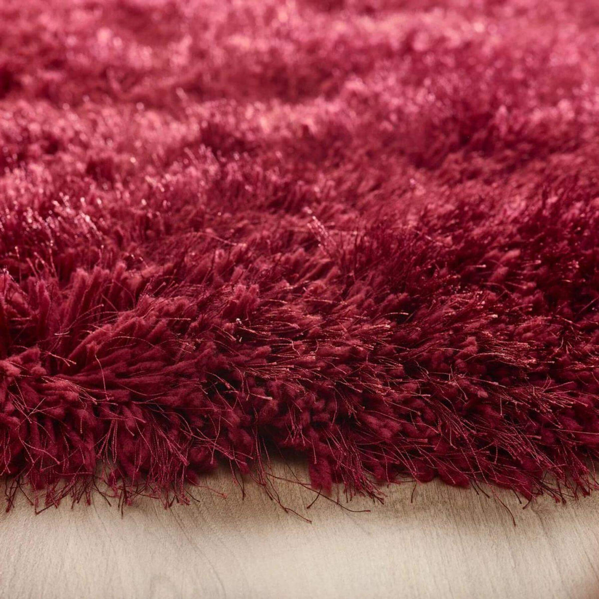 Deep red shaggy rug with a soft texture, perfect for adding warmth to any room