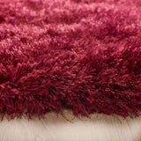 Deep red shaggy rug with a soft texture, perfect for adding warmth to any room