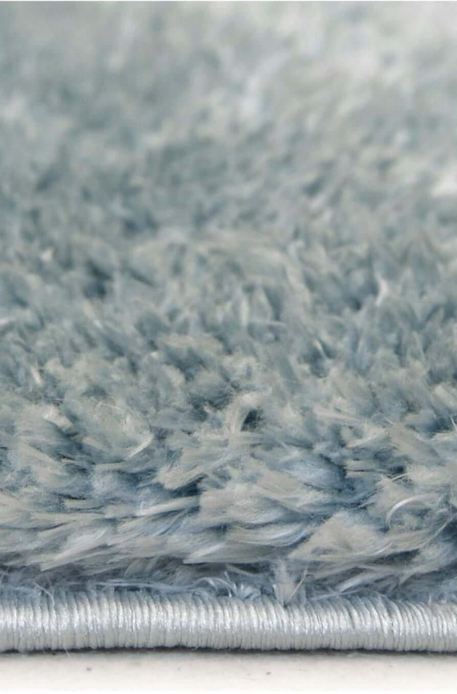 Soft light blue shaggy rug with a thick, plush texture for comfortable warmth and style