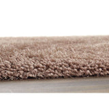 Soft and plush shaggy rug in a warm beige tone for comfortable living spaces