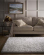 Soft and plush Shaggy Rug in a living room with a beige sofa and decorative cushions