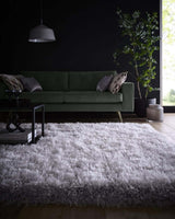 Soft Shaggy Rug in Silver Grey on Wooden Floor in Modern Living Room with Green Sofa