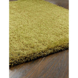 Soft green shaggy rug with a plush texture, perfect for adding warmth to any room